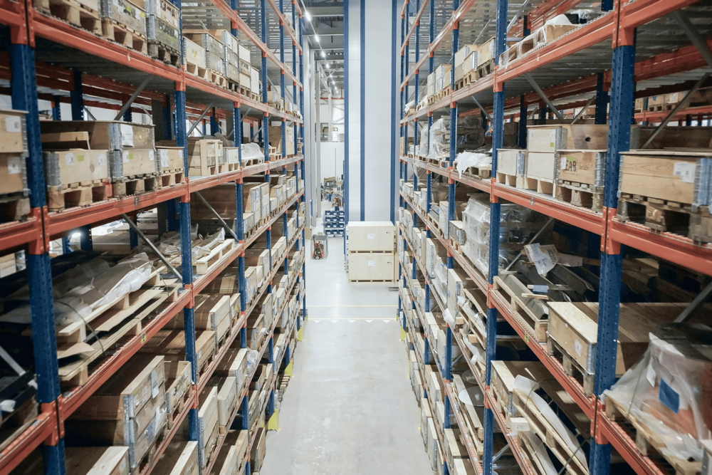 Inventory Management - traditional shelving storage with VLMs in the background